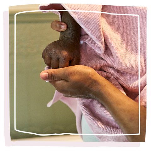 Mum holding child hand