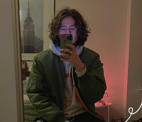 Man taking a selfie in his bedroom 