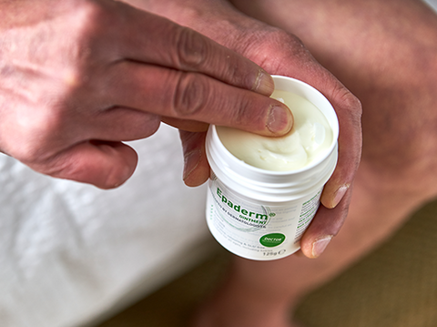 Man scooping Epaderm Ointment onto his fingers