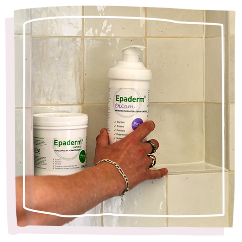 Person reaching for Epaderm Cream in the shower